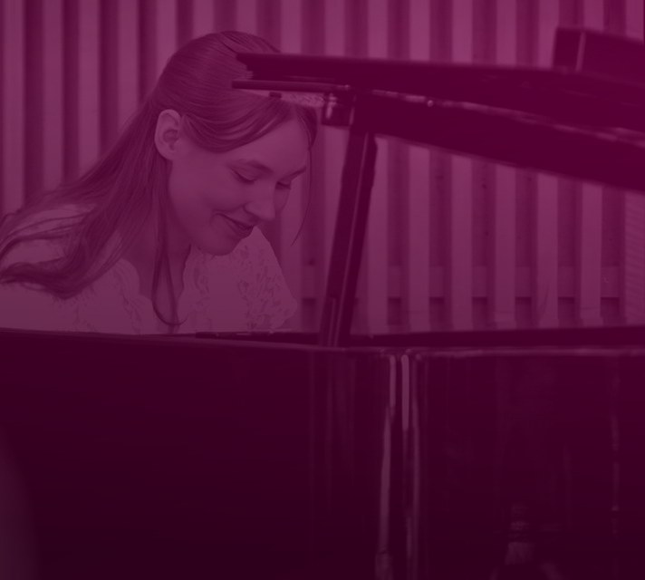 Pianist playing a grand piano