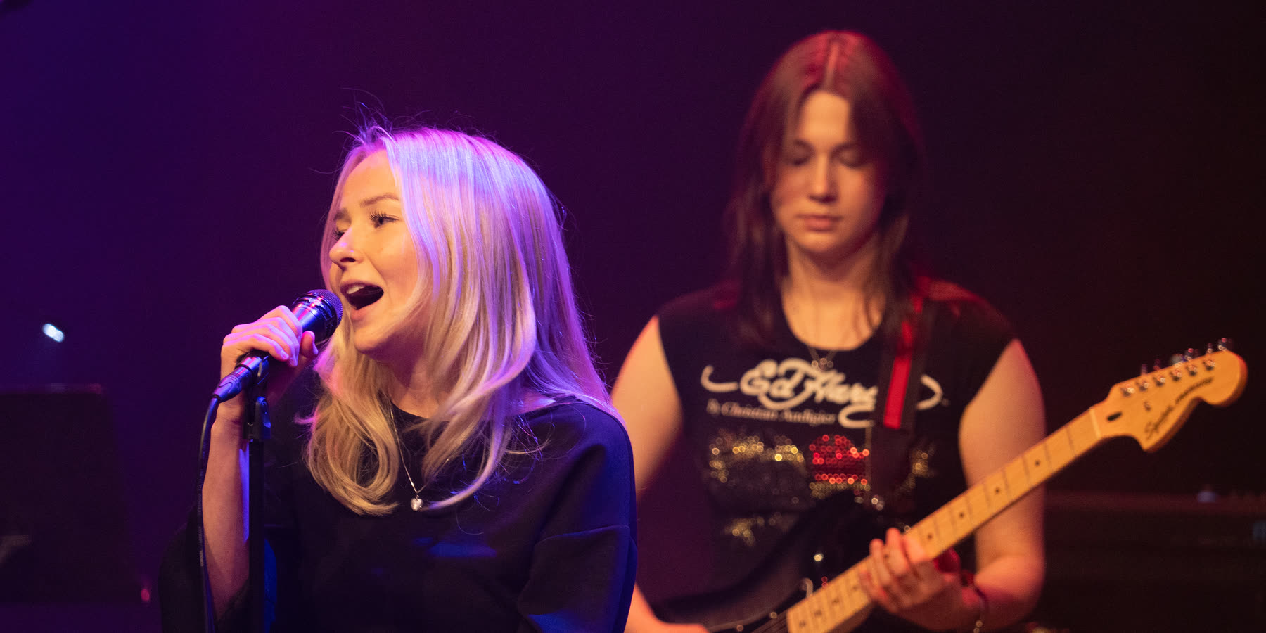 Singer and guitarist on stage
